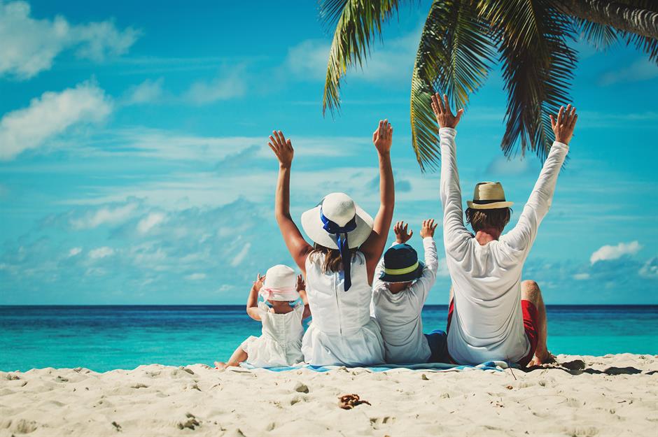 family on tour on a beach